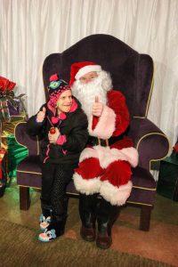 girl poses with santa 