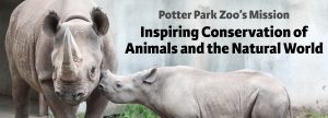 Photo of an adult Black Rhino and a baby Black Rhino. Text on the picture says "Potter Park Zoo's Mission. Inspiring Conservation of Animals and the Natural World."